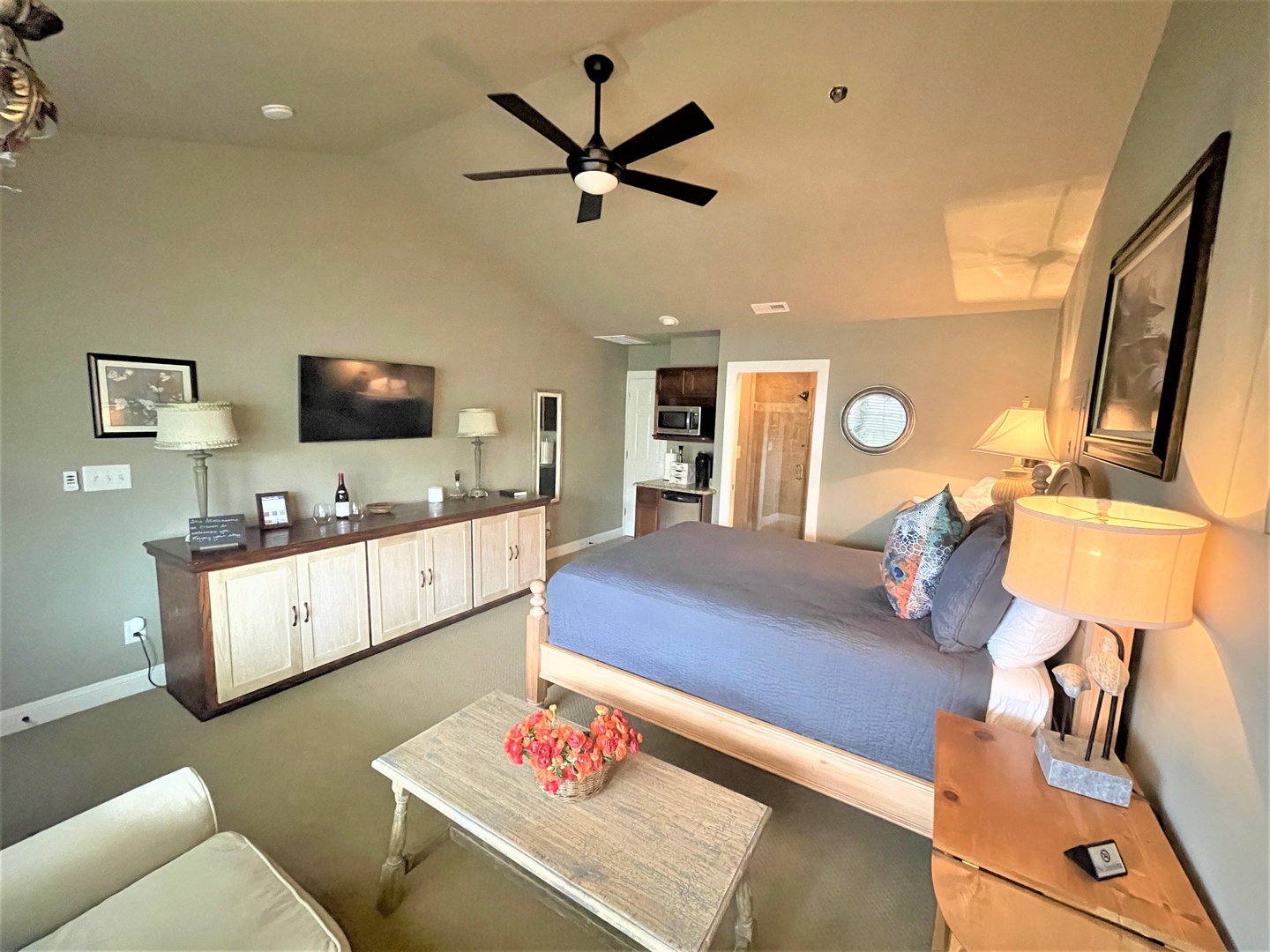 Your spacious room combines comfort and style with a cozy bed, modern amenities, and thoughtful touches like fresh flowers welcoming you.