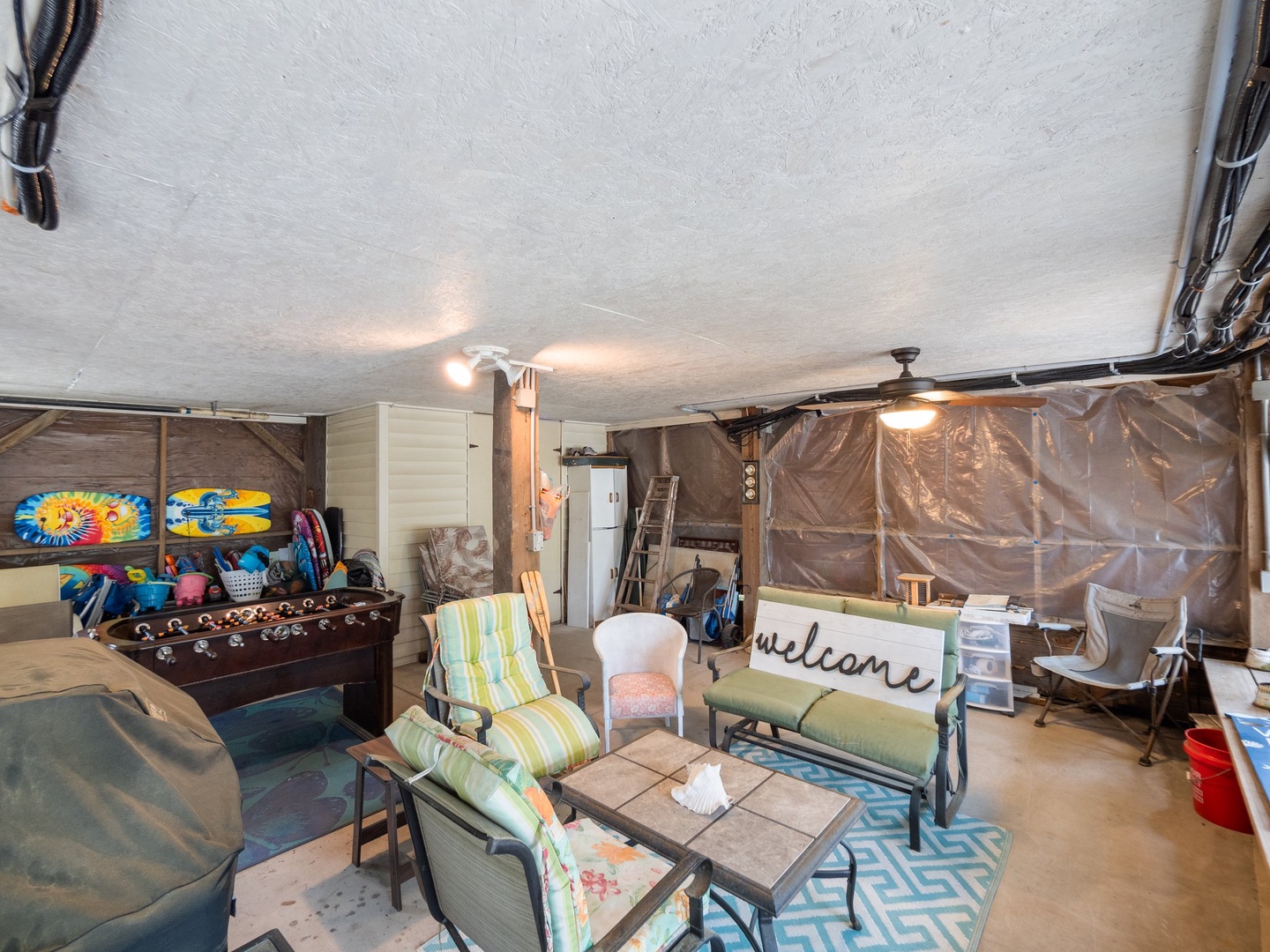 Your private game room awaits with foosball, beach gear, and cozy seating for family fun and relaxation.