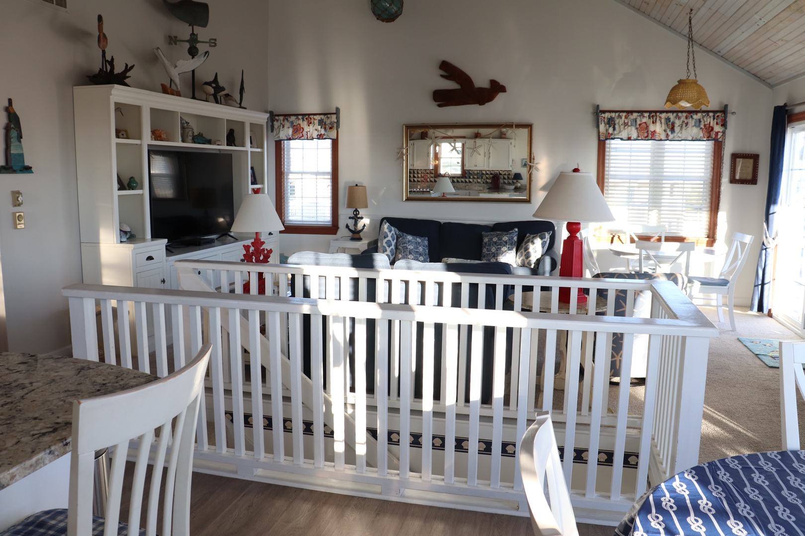 Unwind in your charming nautical-themed retreat, where coastal decor and cozy seating create the perfect atmosphere for relaxation.