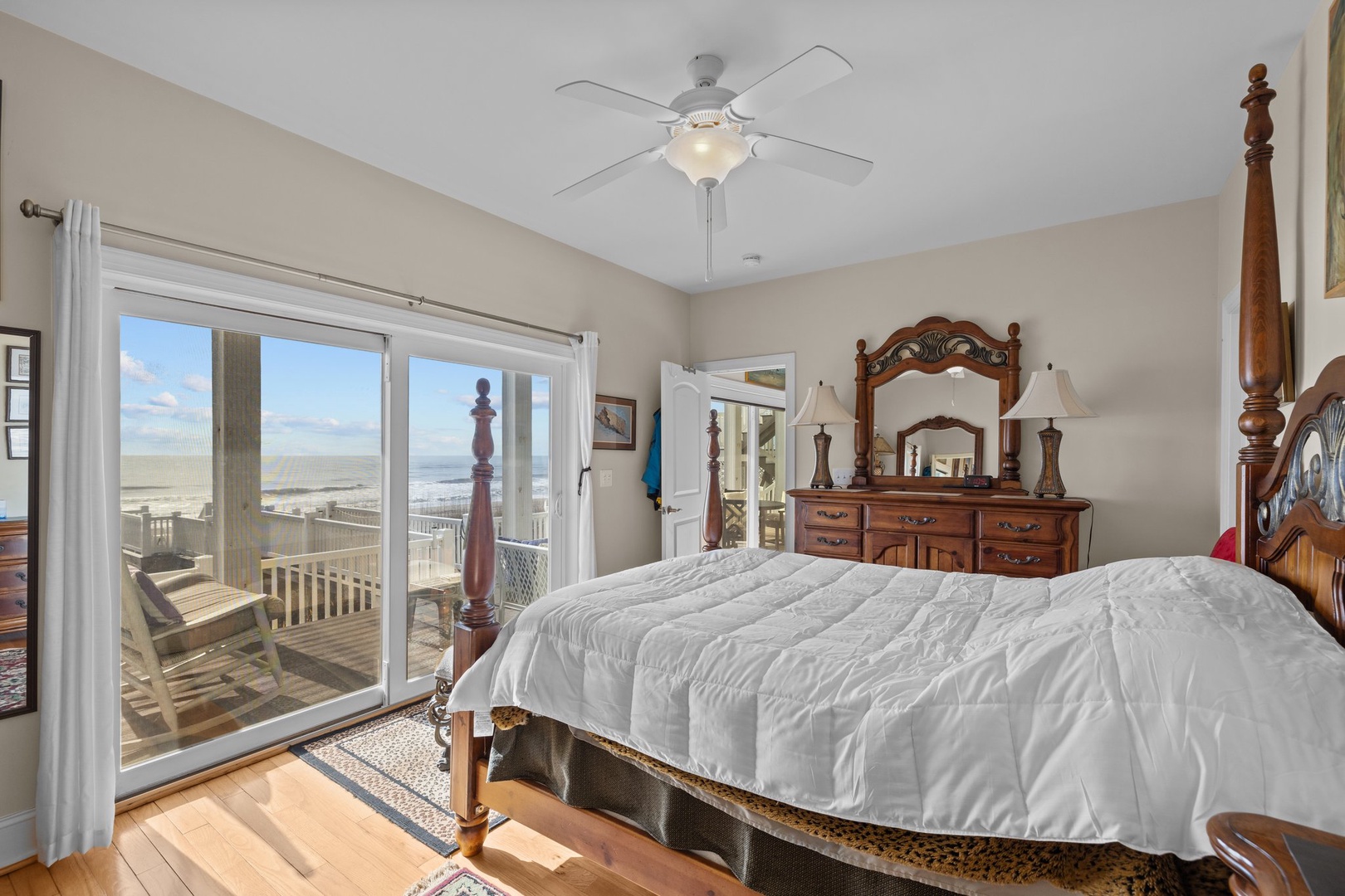 Wake up to stunning ocean views from your comfortable four-poster bed, with direct balcony access to enjoy morning coffee overlooking the beach.