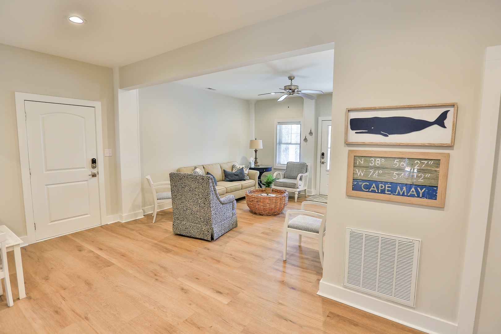 Relax in your coastal retreat with warm hardwood floors, comfortable seating, and charming nautical touches that make you feel at home.
