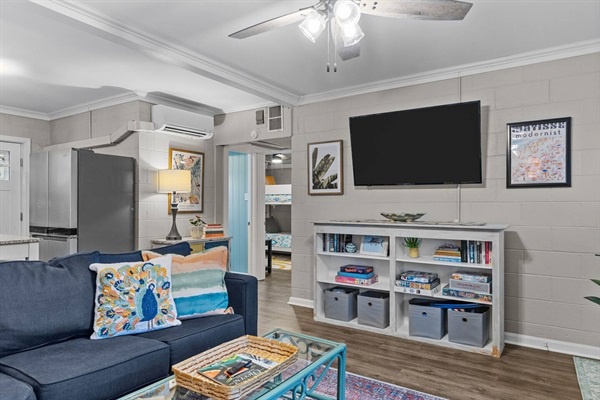 Relax in your stylish living space with modern comforts—ceiling fan, AC, and smart storage keep everything perfectly organized for your stay.