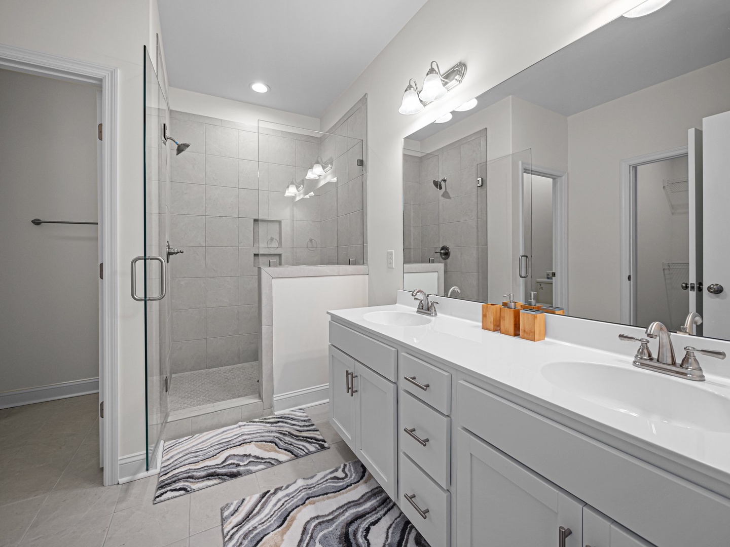 Refresh in your elegant ensuite bathroom with spacious walk-in shower, dual vanity, and modern finishes creating a spa-like retreat.