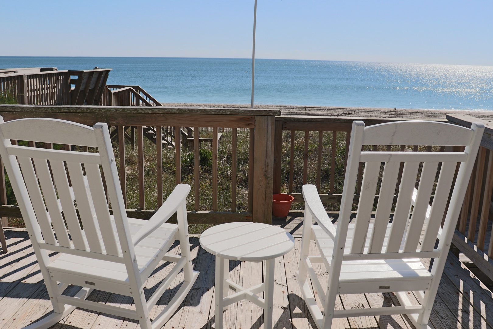 Settle into your private deck chairs with stunning ocean views stretching endlessly before you, perfect for morning coffee or sunset relaxation.