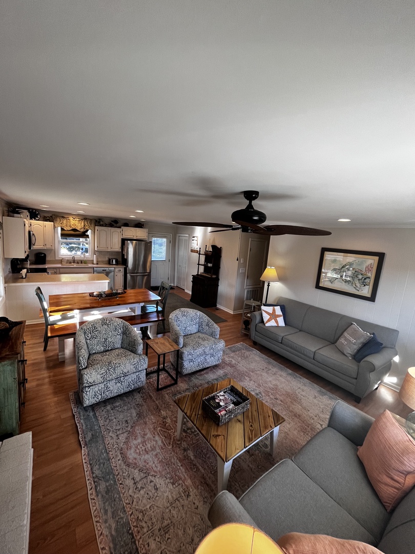 Sink into plush seating in your stylish living room, where modern comfort meets warm wood tones and thoughtful design details.