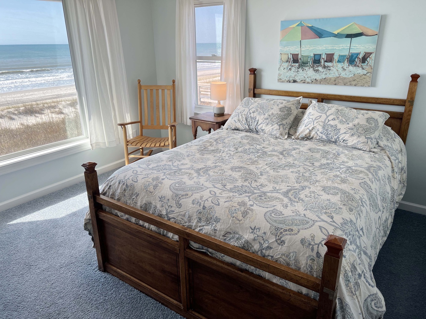 Wake up to stunning ocean views from your comfortable bed, where beach artwork and coastal charm create the perfect seaside retreat.