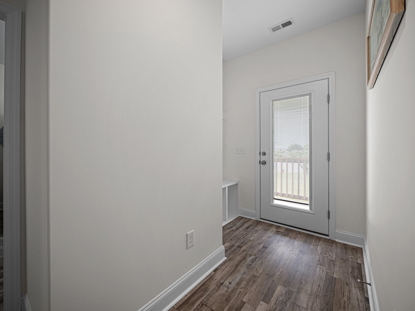 Step into your private entrance with gleaming hardwood floors and fresh white walls that welcome you home each day.