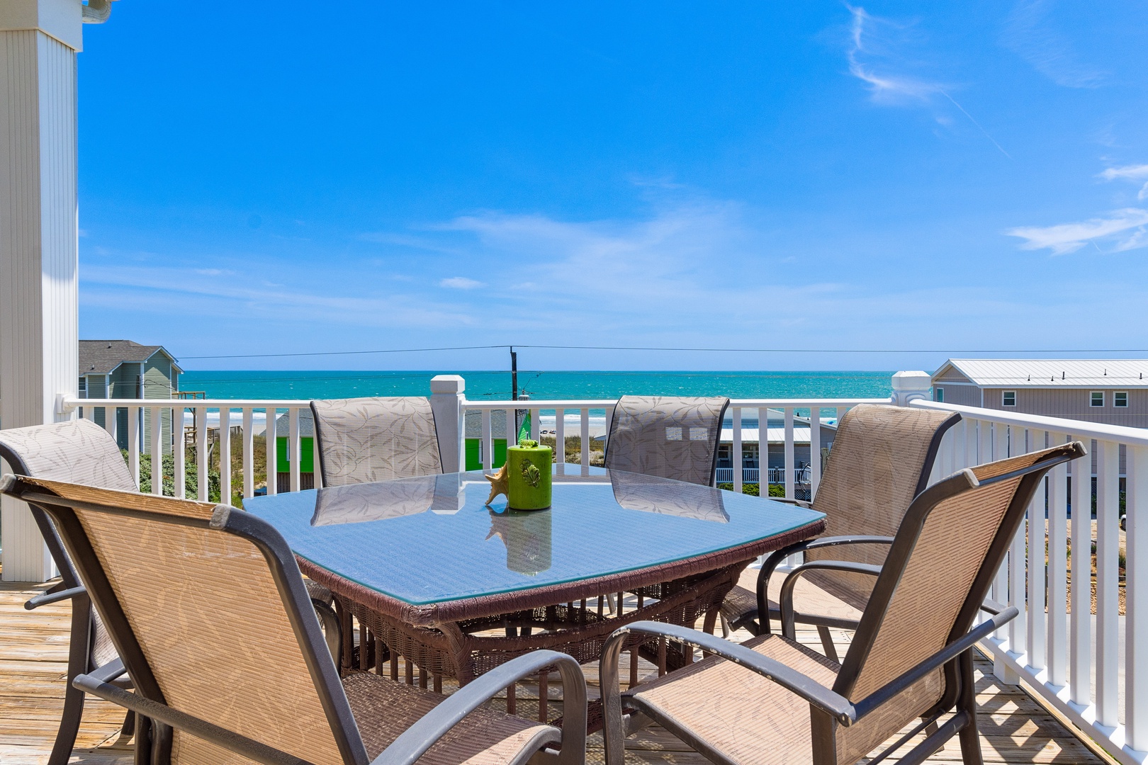 Savor morning coffee while watching waves dance across turquoise waters from your private oceanfront balcony.