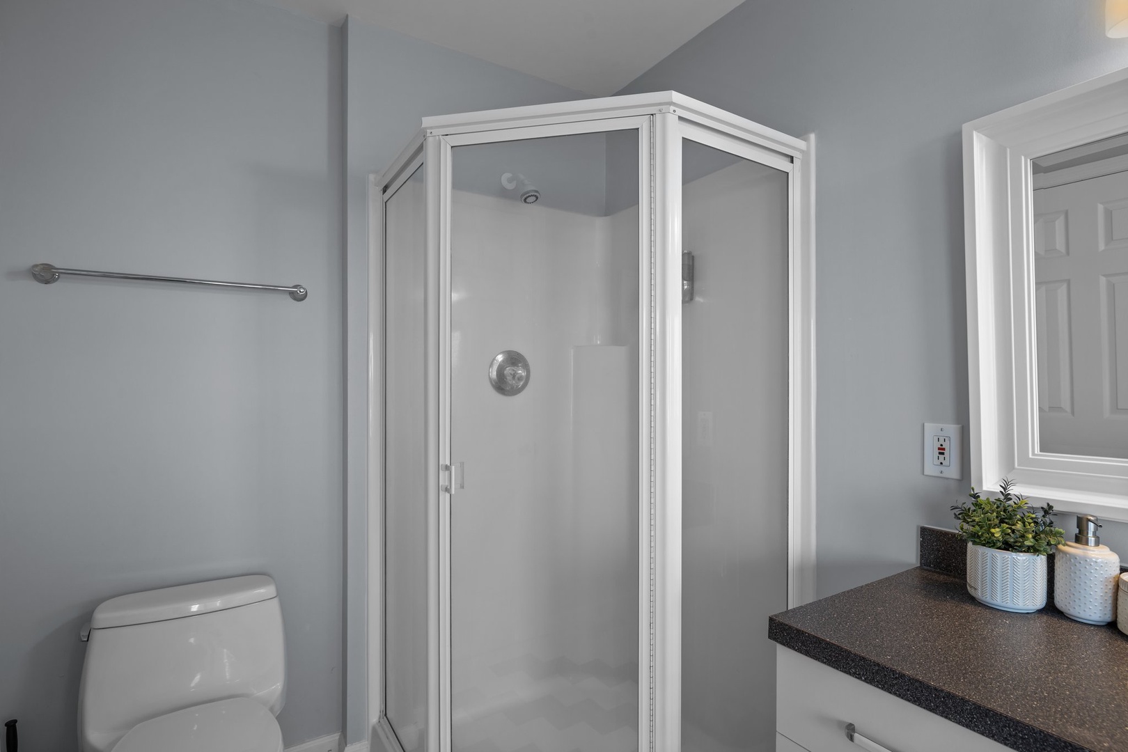 Freshen up in your private bathroom with a spacious shower, modern fixtures, and thoughtful touches that make your stay comfortable.