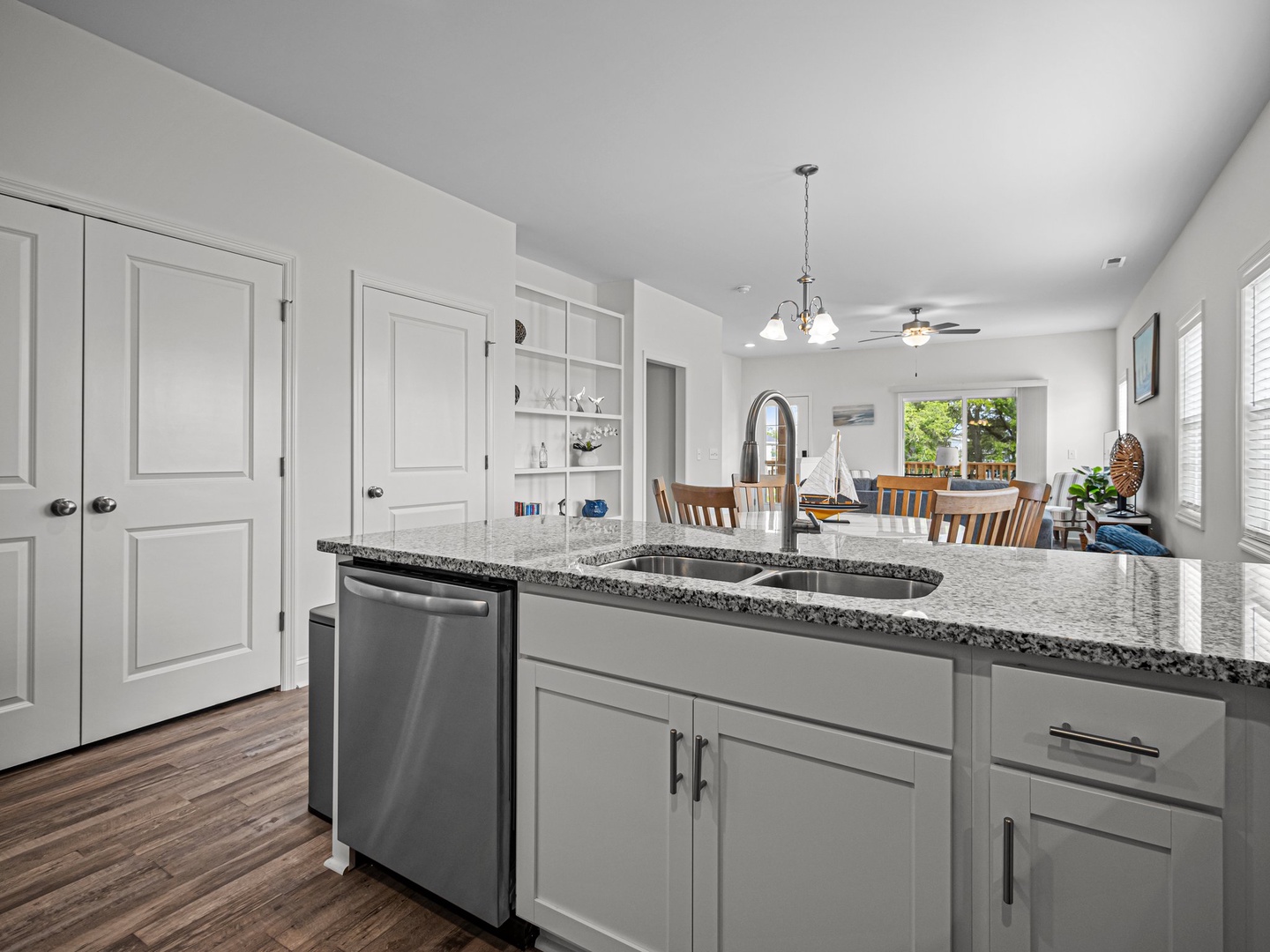 Your modern kitchen features granite countertops, stainless steel appliances, and flows seamlessly into the bright dining area.