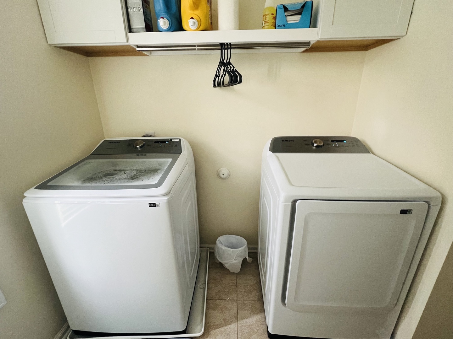 Your dedicated laundry space features full-size washer and dryer with convenient storage above for all your travel essentials.