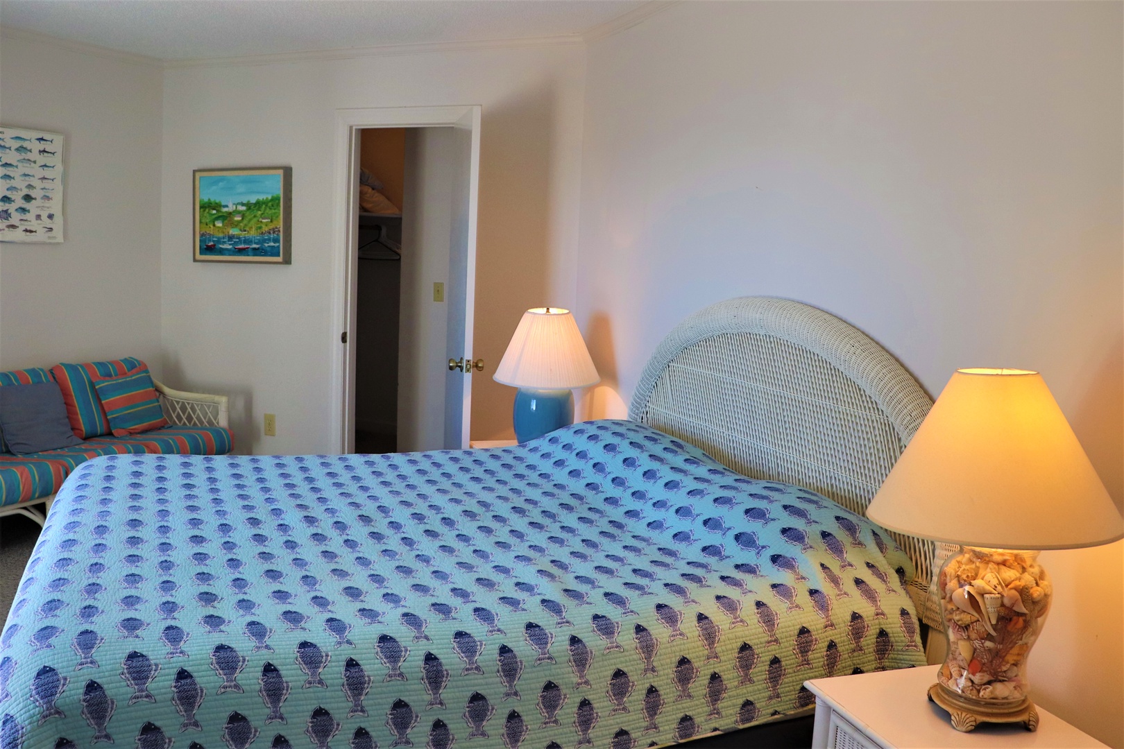 Relax in your comfortable bedroom with warm bedside lighting and cozy seating area for quiet evening moments.