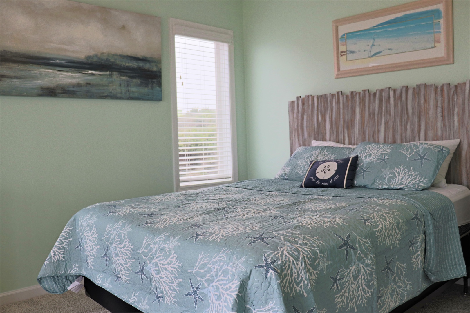 Drift into peaceful sleep surrounded by ocean-inspired decor and gentle sea-green tones in your coastal bedroom retreat.