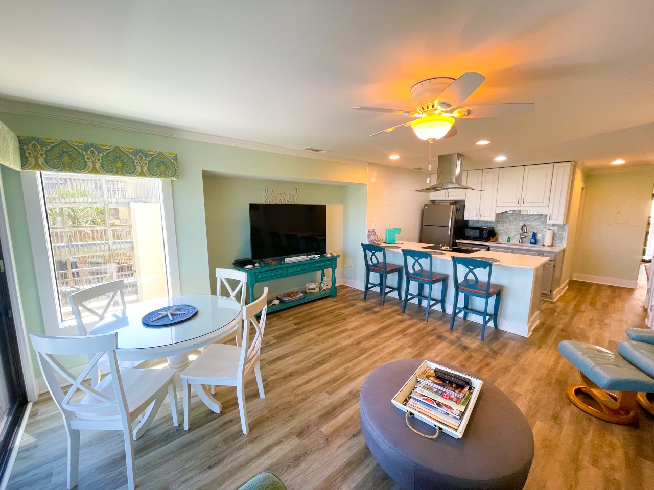 Relax in your bright, open-concept space where coastal colors and modern comforts create the perfect beach getaway atmosphere.