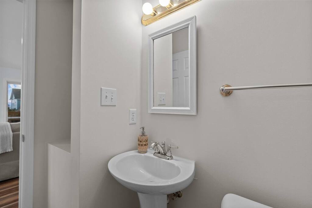 Your private powder room features classic fixtures and thoughtful touches, perfect for freshening up during your stay.