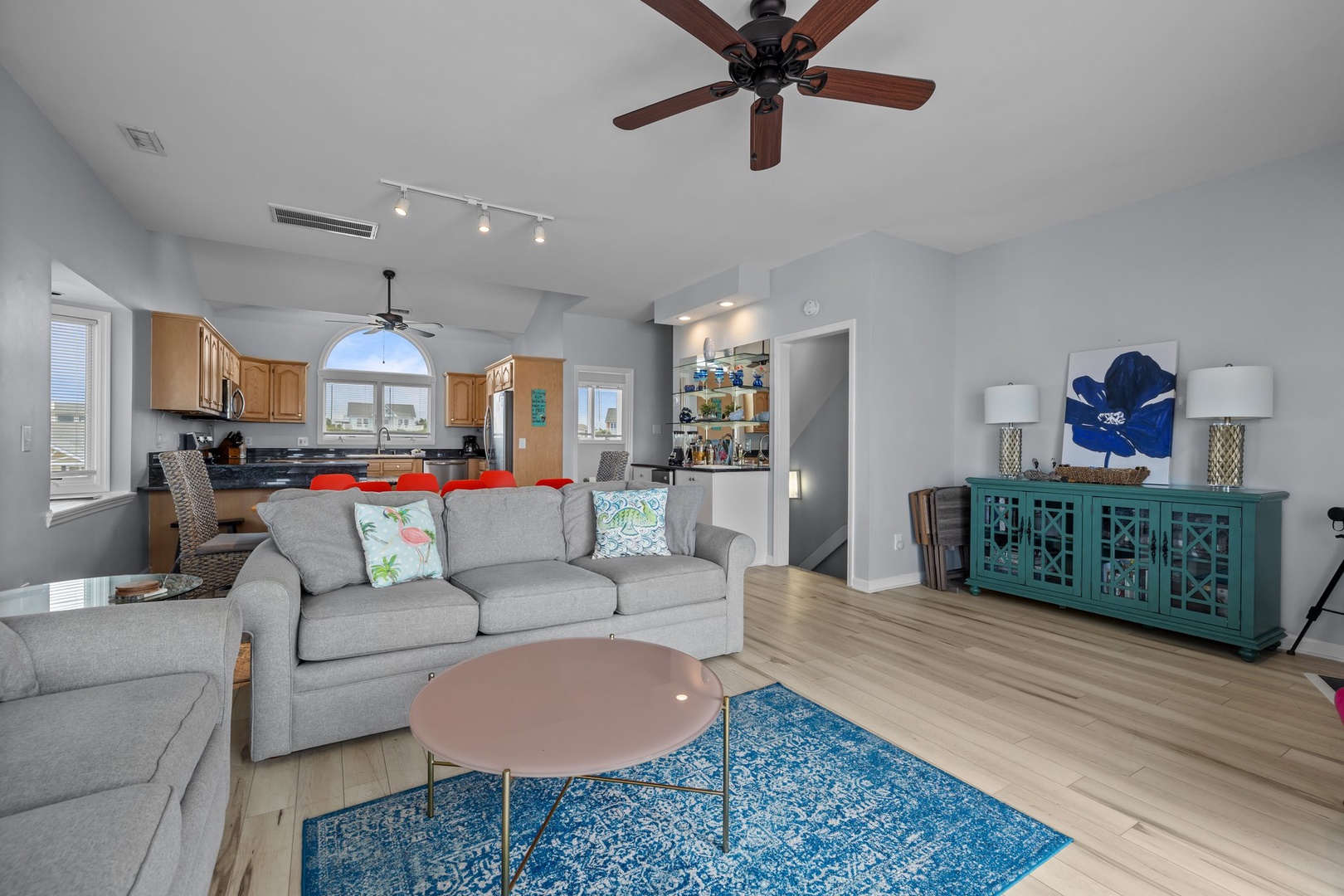 Relax in your stylish open-plan living space with coastal touches and modern comfort.