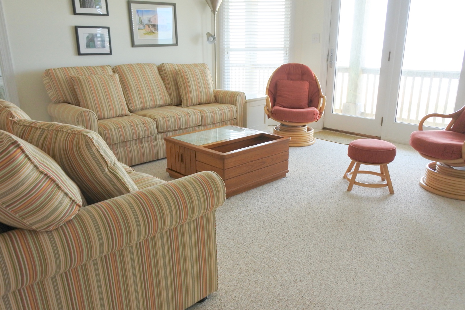 Sink into striped sofas and swivel chairs where you'll unwind with coffee table books and ocean breezes through your sliding doors.