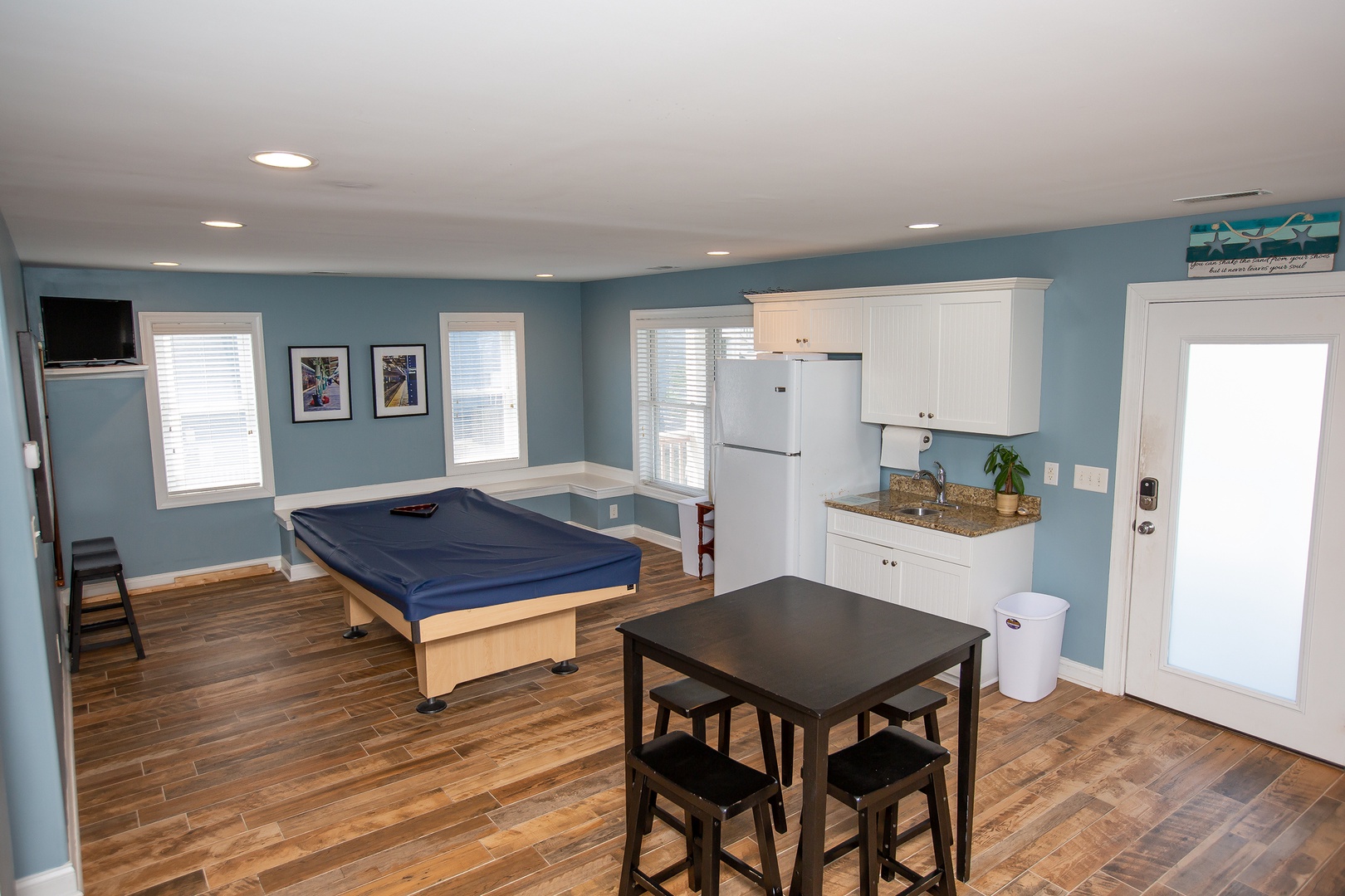 Your entertainment space combines fun and function with a pool table, dining area, and kitchenette - perfect for relaxing evenings with friends.
