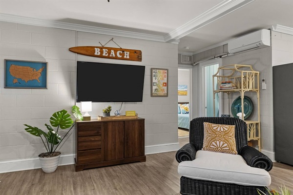Relax in your coastal-themed living space with beach vibes, modern entertainment setup, and convenient laundry access.
