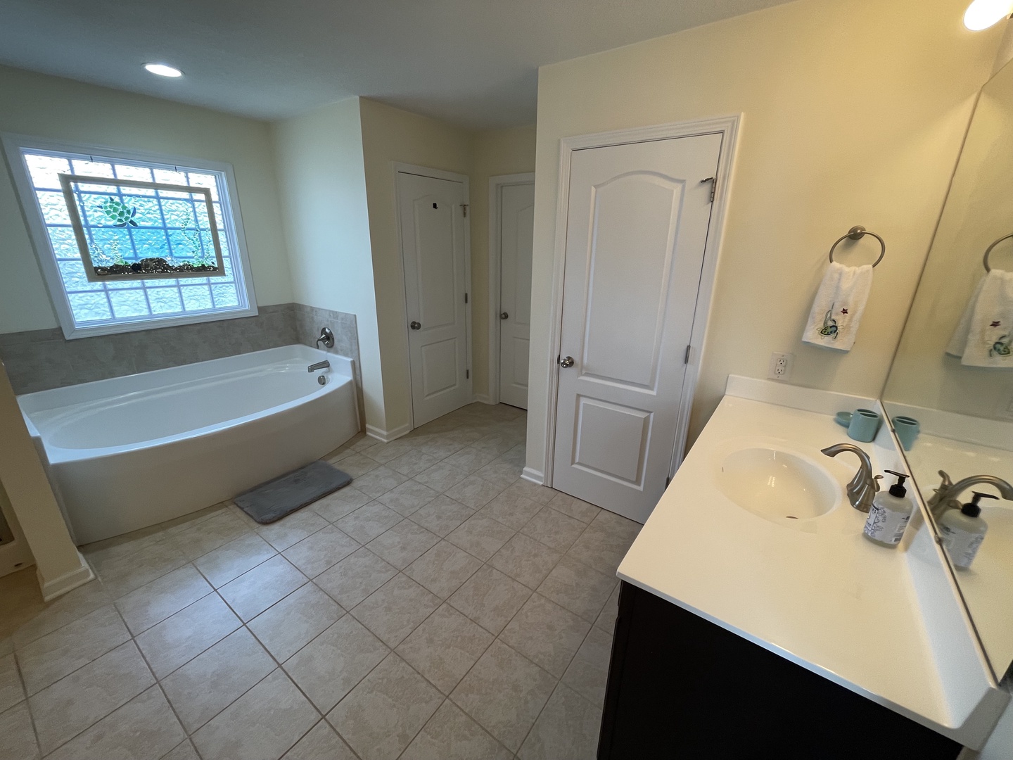 Unwind in your spacious master bathroom with a luxurious soaking tub and dual vanities for comfort and convenience.