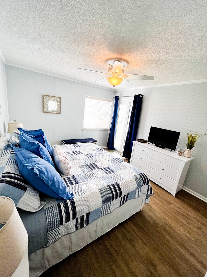 Unwind in your cozy bedroom with soft linens, smart TV for entertainment, and gentle ceiling fan for perfect comfort.