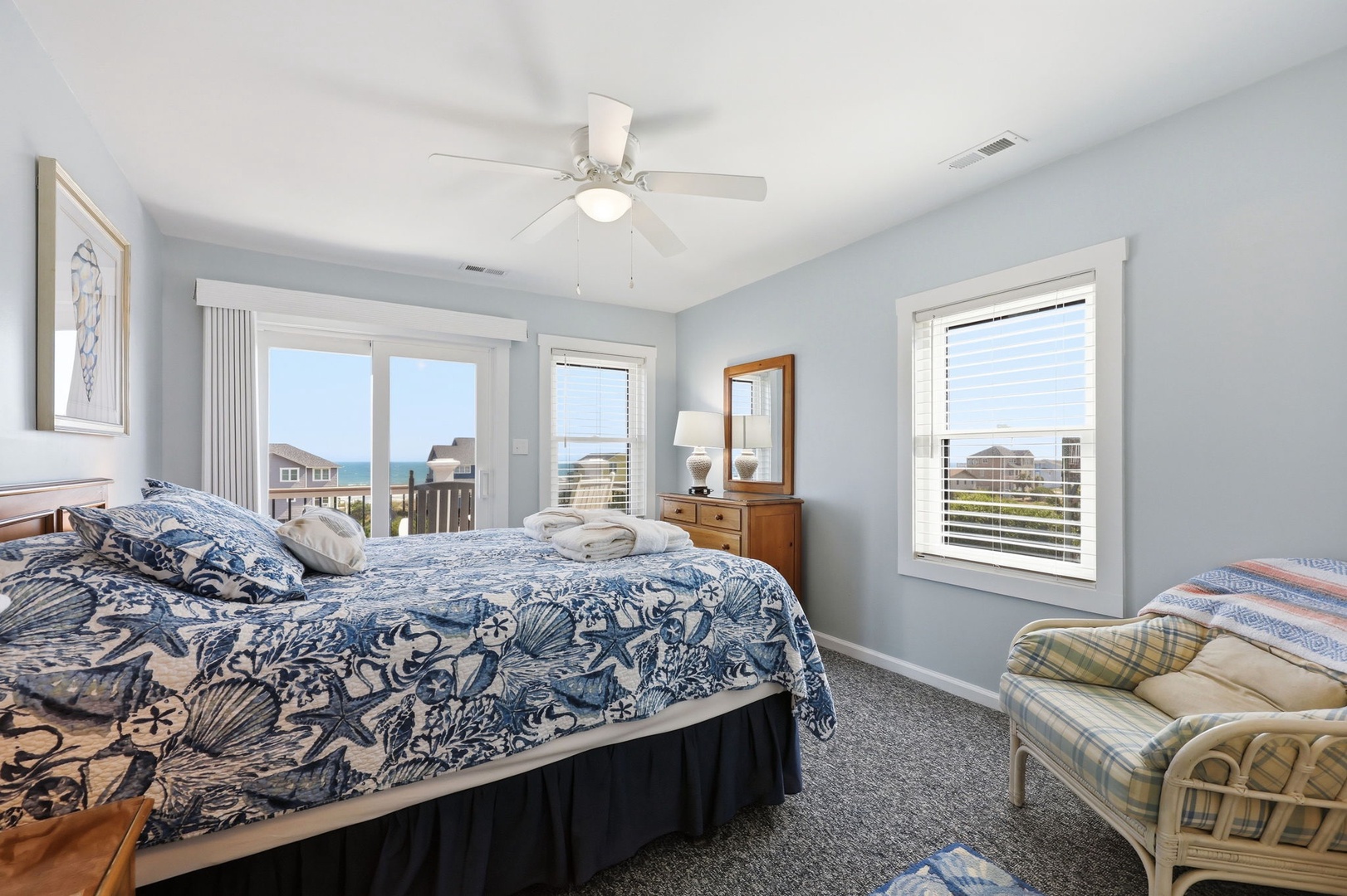 Wake to soft coastal light and ocean breezes in your serene, light-filled retreat with stunning sea views from three windows.