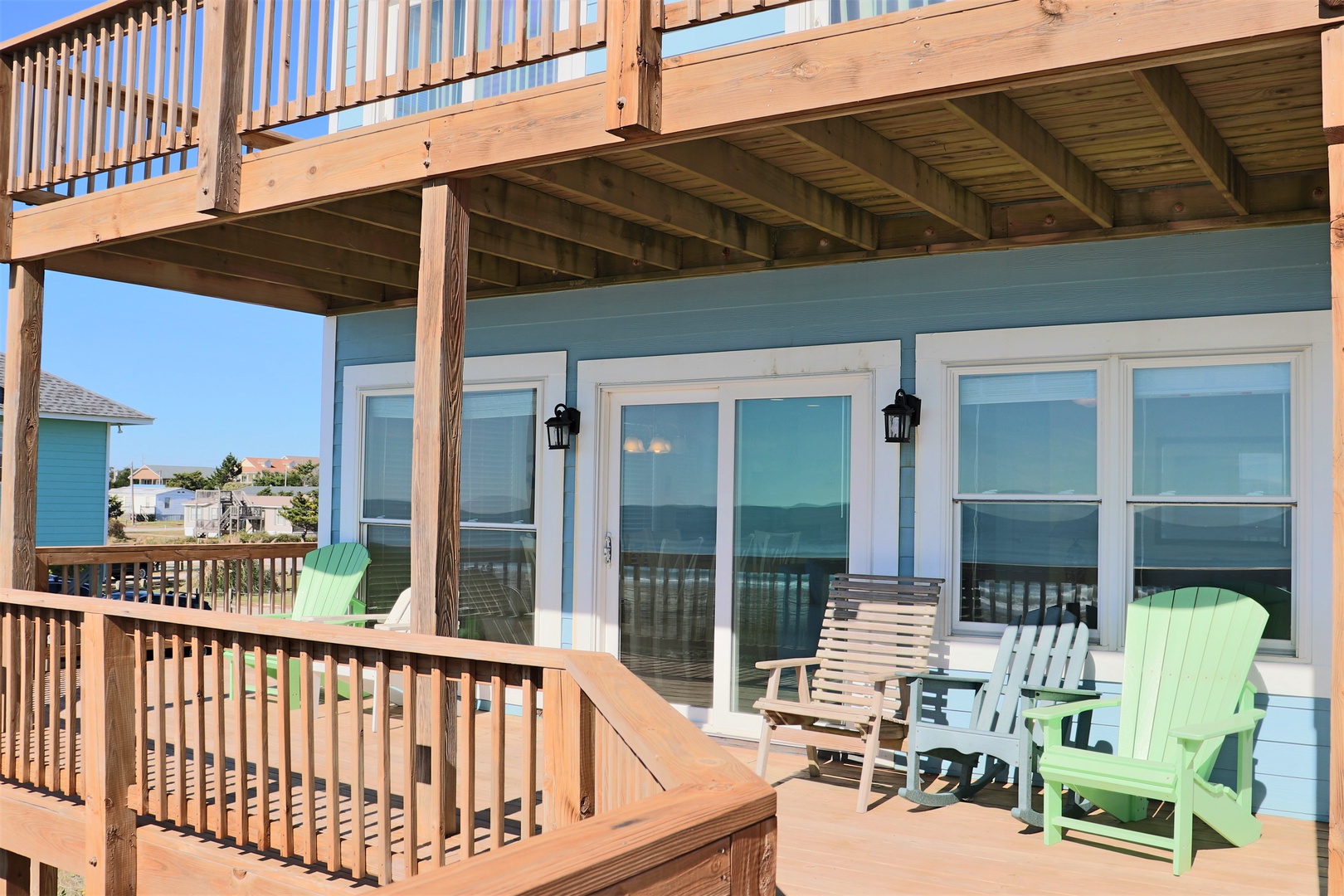 Relax in colorful Adirondack chairs on your private deck, where ocean breezes and stunning water views create the perfect retreat.