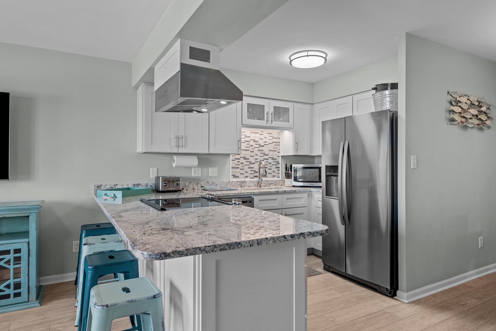Your modern kitchen features granite countertops, stainless appliances, and a breakfast island perfect for morning coffee and meal prep.