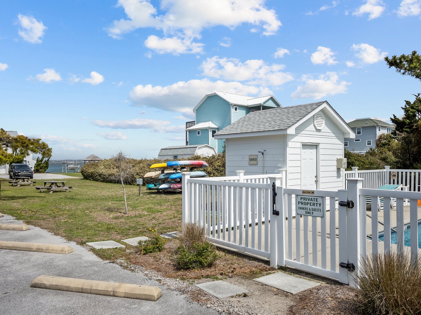 Charming coastal property with kayak storage and waterfront access in a peaceful neighborhood setting.