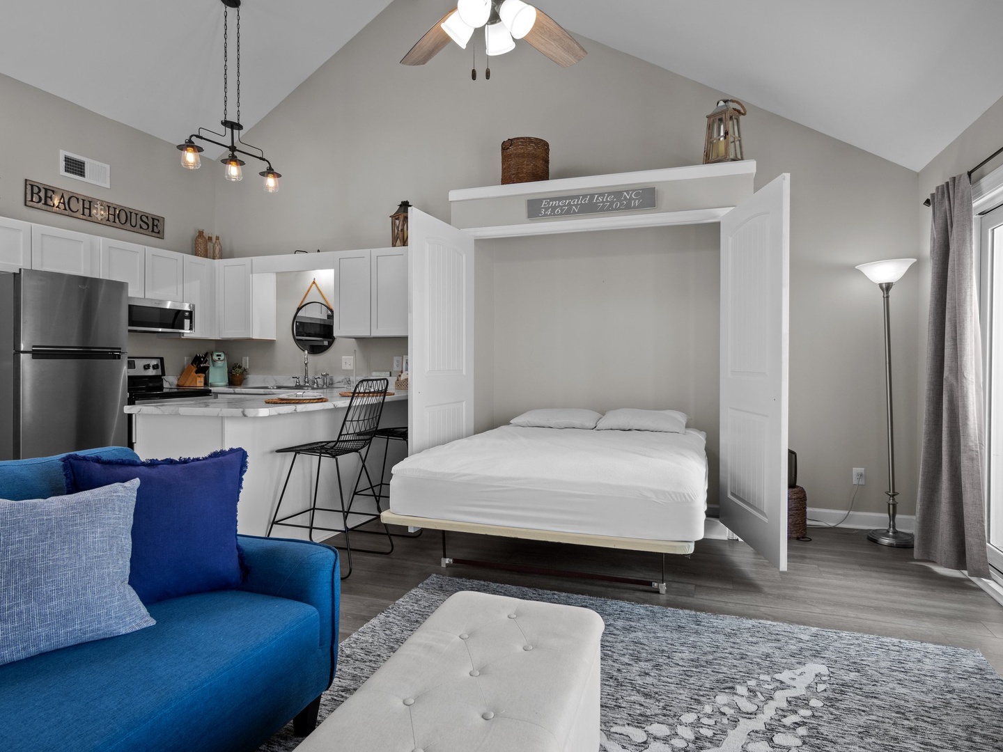 Your stylish studio maximizes space with a convenient Murphy bed and open design connecting kitchen, living, and sleeping areas.