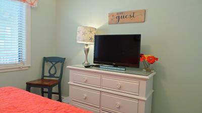 Your comfortable bedroom features a flat-screen TV and dresser for all your belongings, creating the perfect retreat after exploring.
