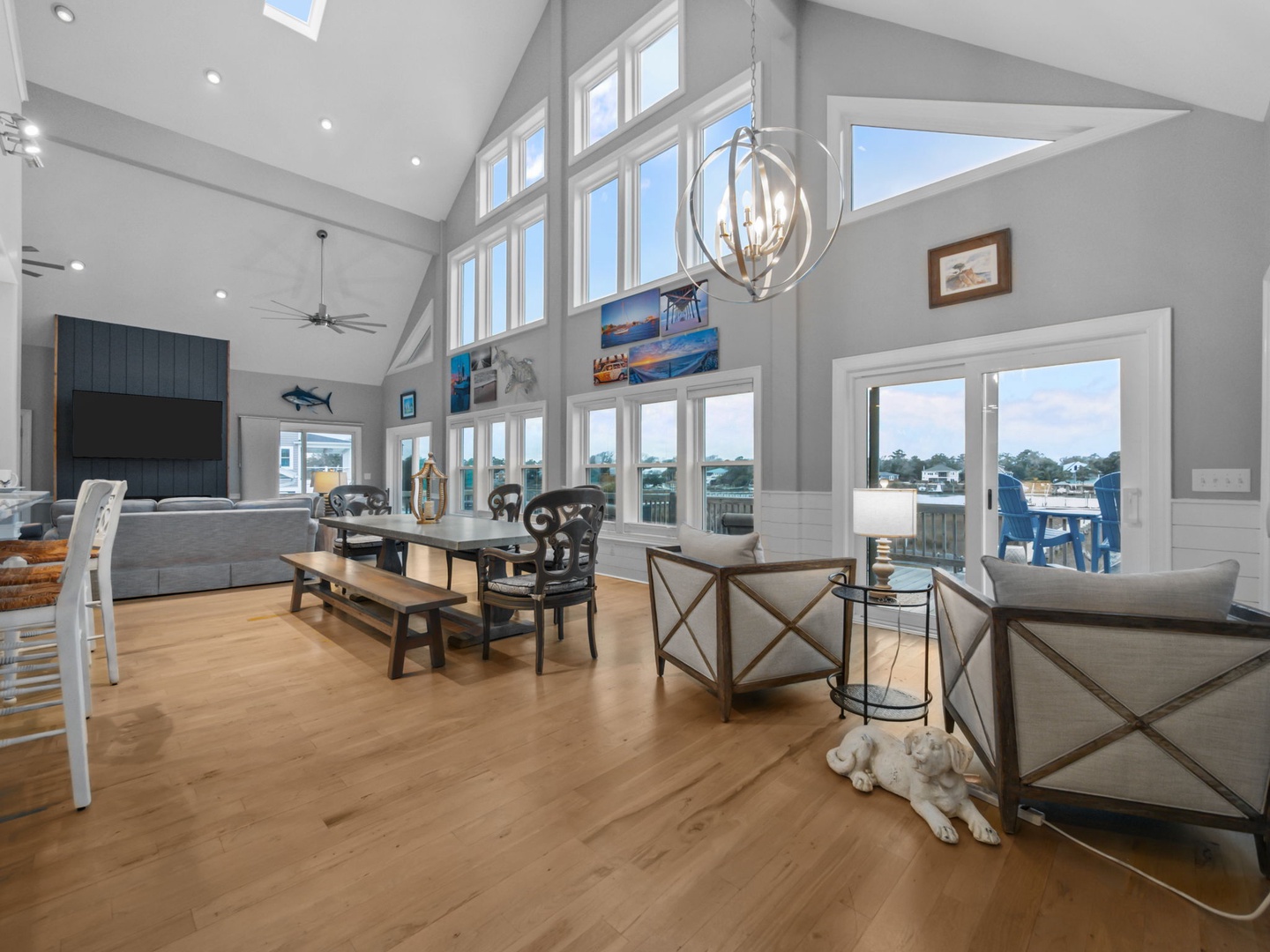 Relax in this bright, airy living space with soaring ceilings and panoramic windows that flood the room with natural light.