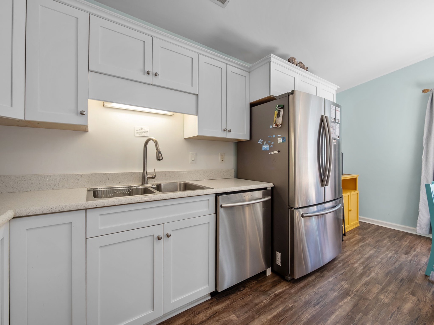 Your bright kitchen features modern stainless steel appliances and ample counter space for preparing meals during your stay.