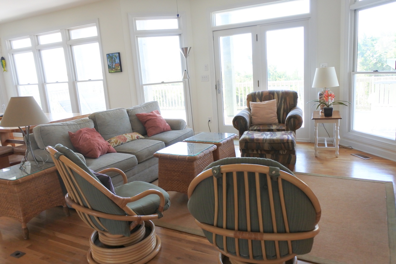 Relax in your bright, airy living space with comfortable seating and sweeping windows that flood the room with natural light.