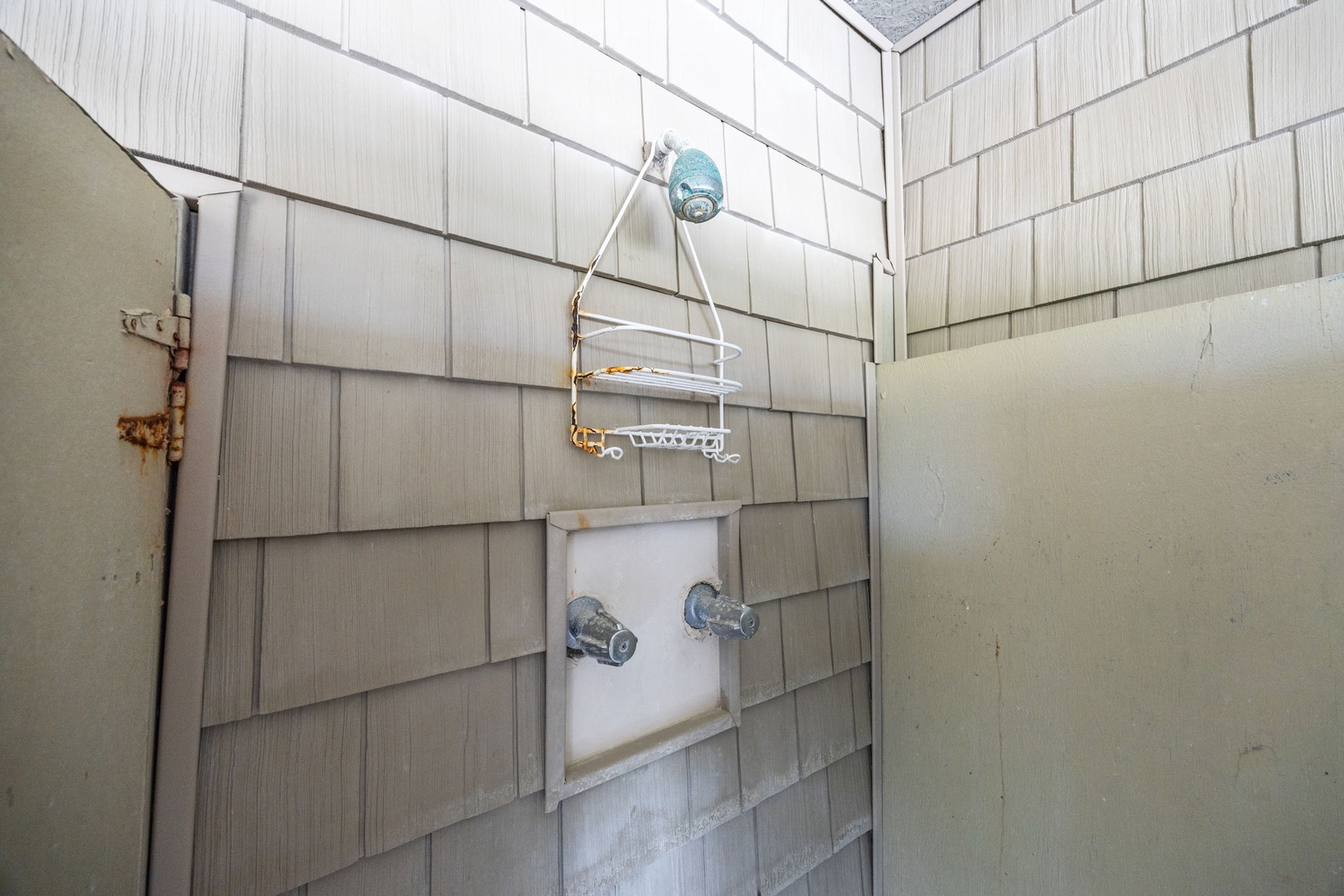 Your private shower awaits with convenient caddy storage for toiletries and refreshing rainfall overhead.