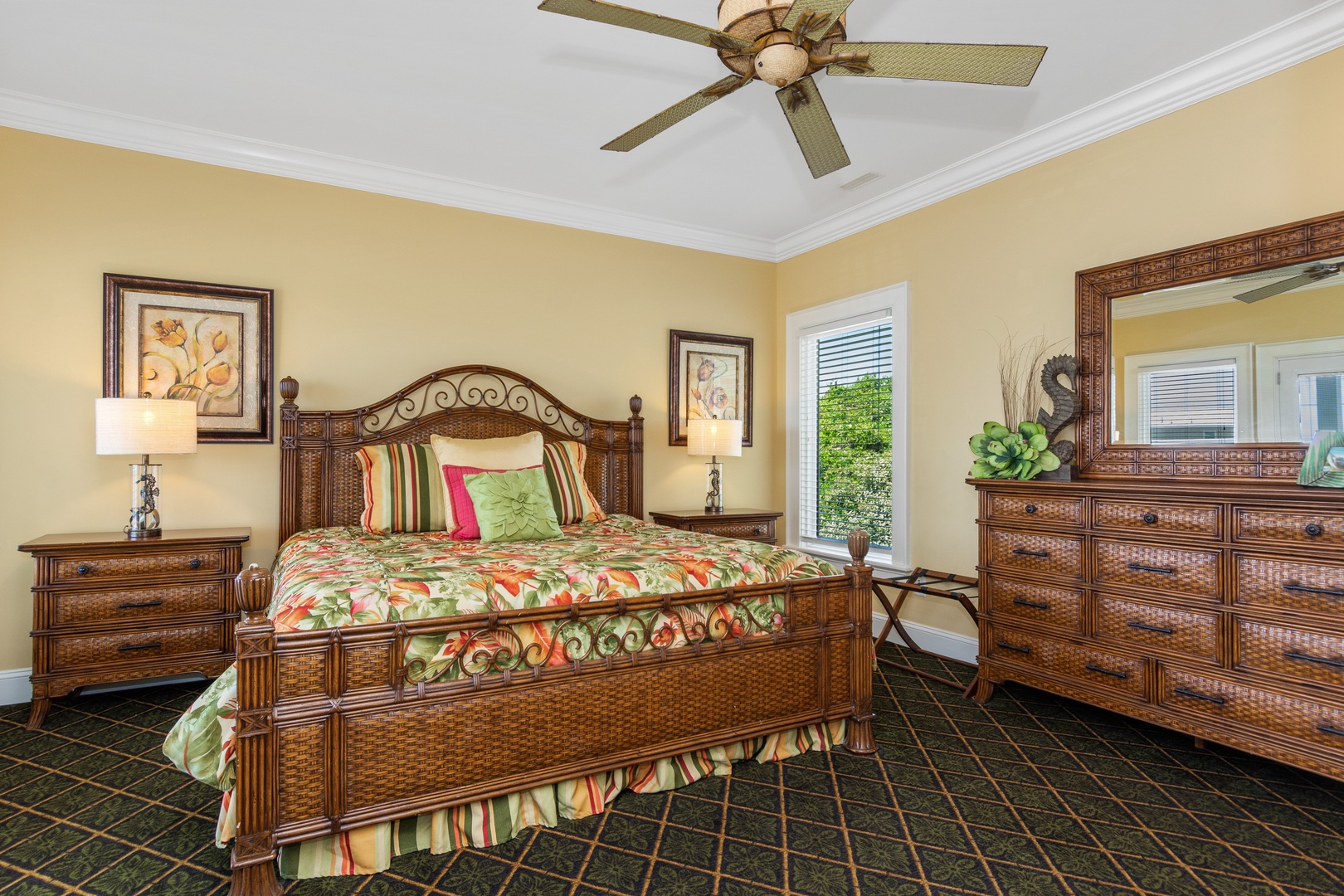 Relax in your tropical-themed bedroom with elegant wicker furniture, colorful bedding, and plenty of storage for your vacation wardrobe.