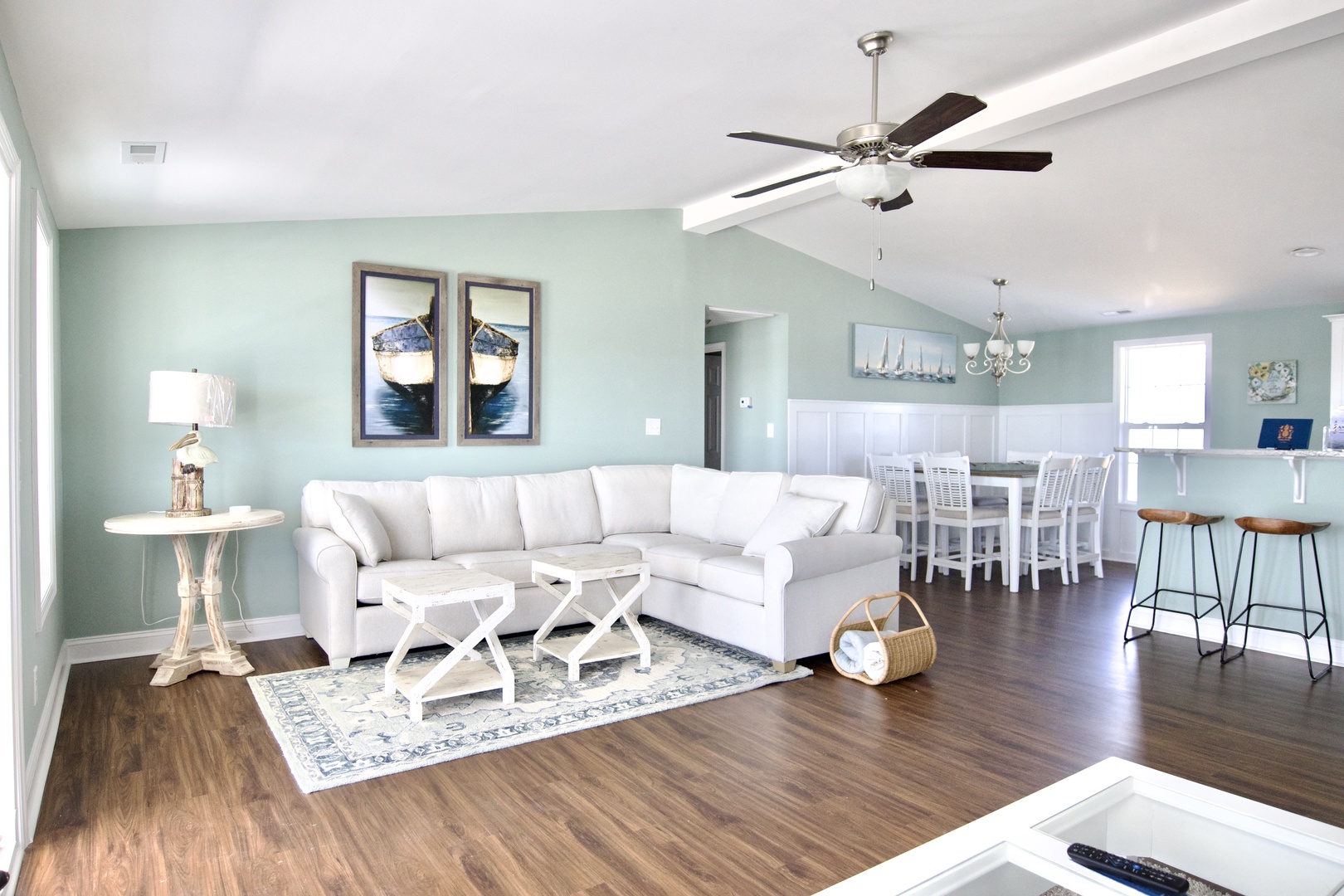Relax in your bright, coastal-inspired living space with plush seating and open flow to your dining area and kitchen.
