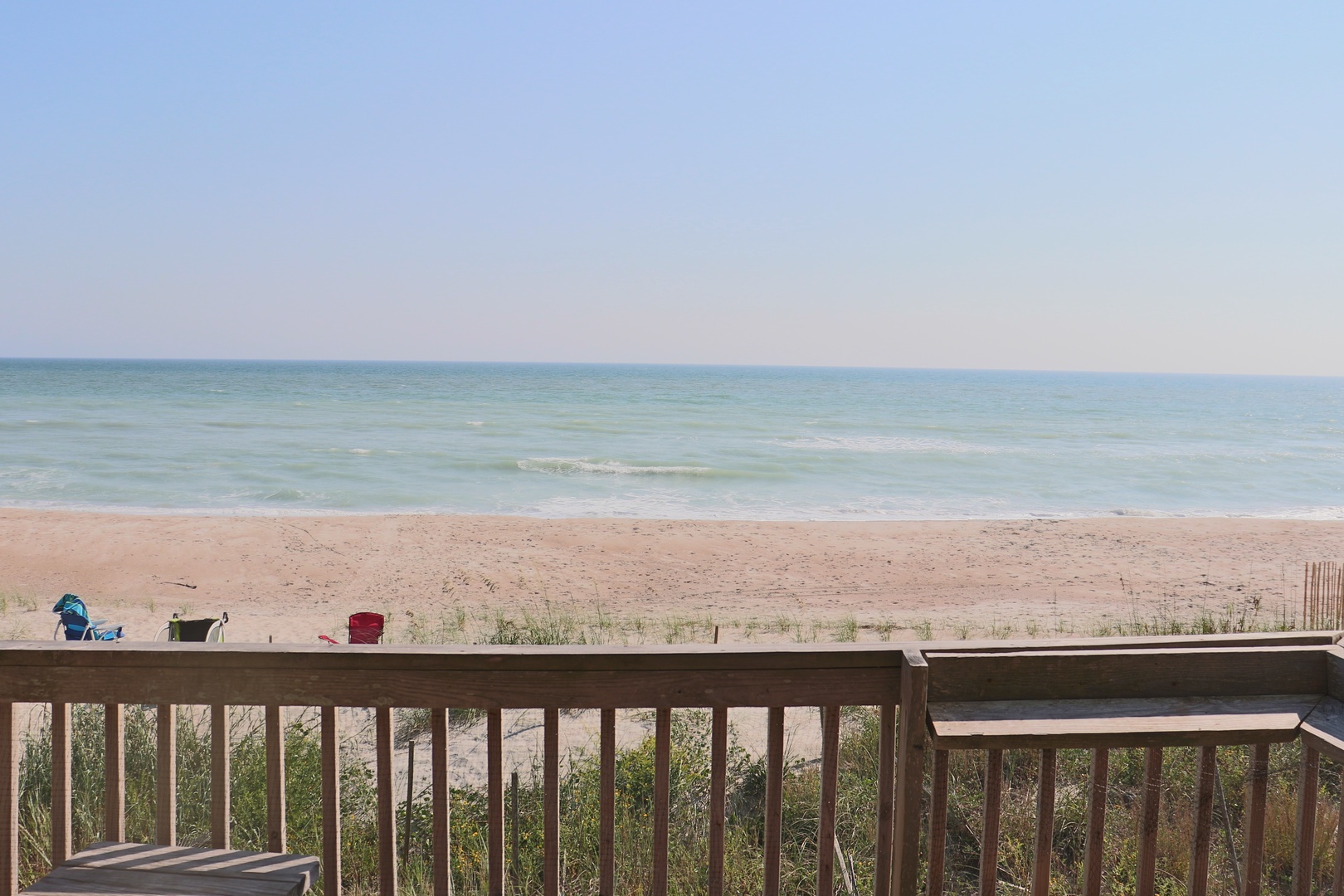 Wake up to endless ocean views from your private deck, where gentle waves meet pristine sand just steps away.