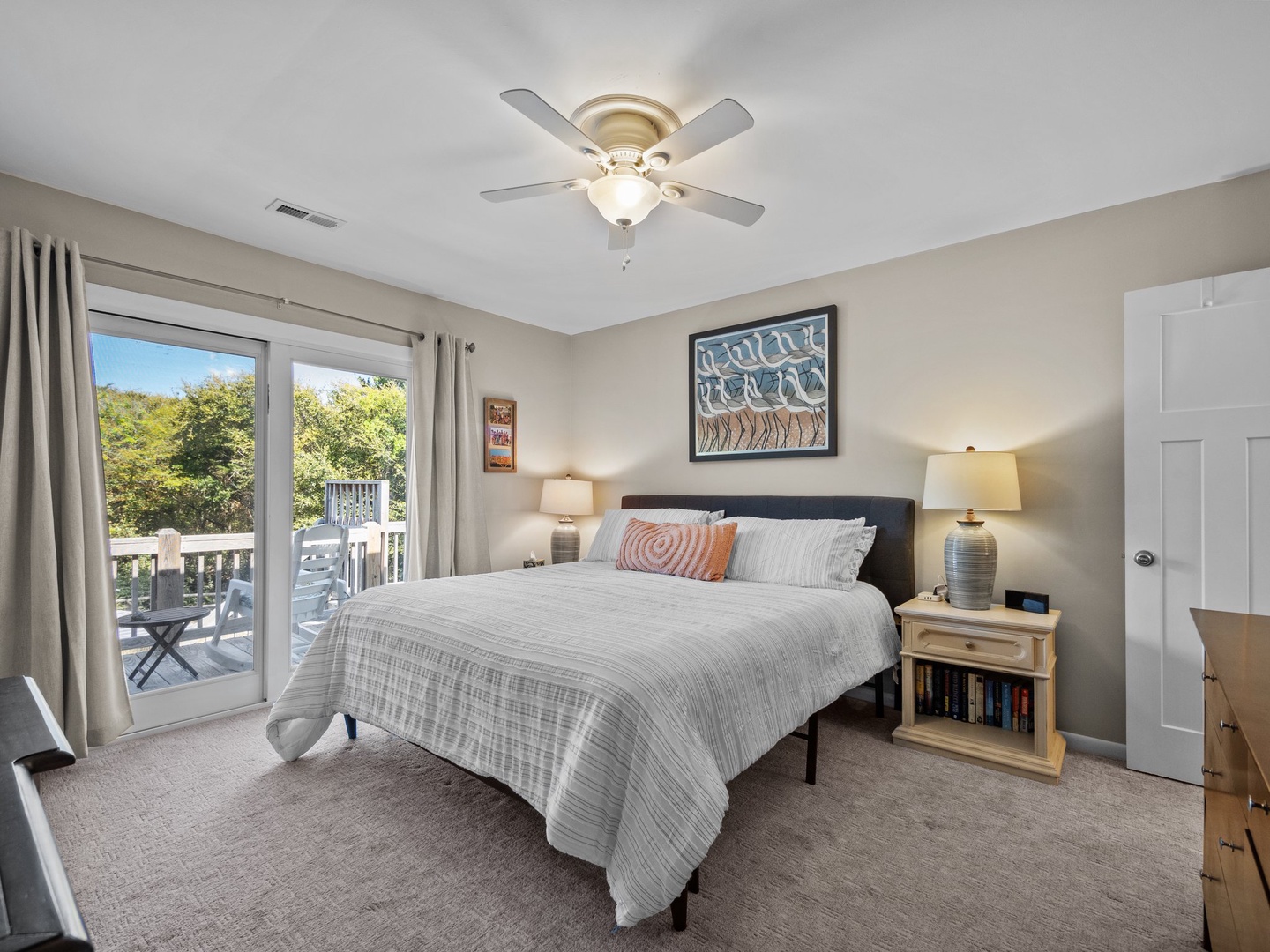 Wake up refreshed in your cozy bedroom, where crisp linens and gentle ceiling fan breezes create the perfect retreat.
