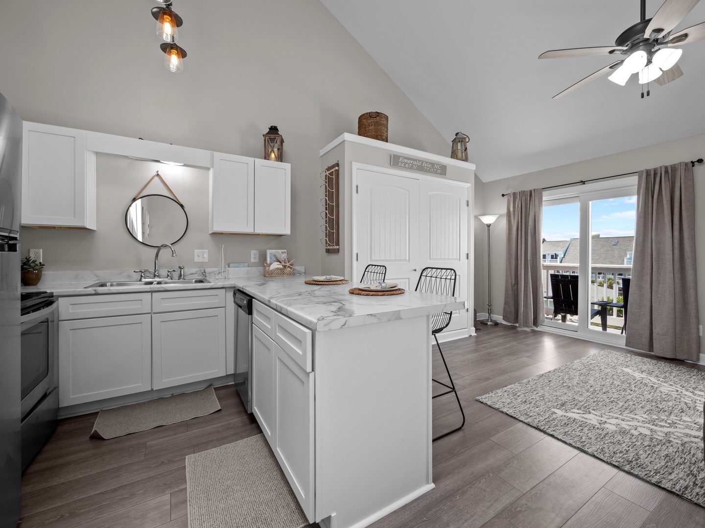 Your bright kitchen features marble countertops, modern appliances, and a breakfast island where you can enjoy morning coffee while natural light streams in.