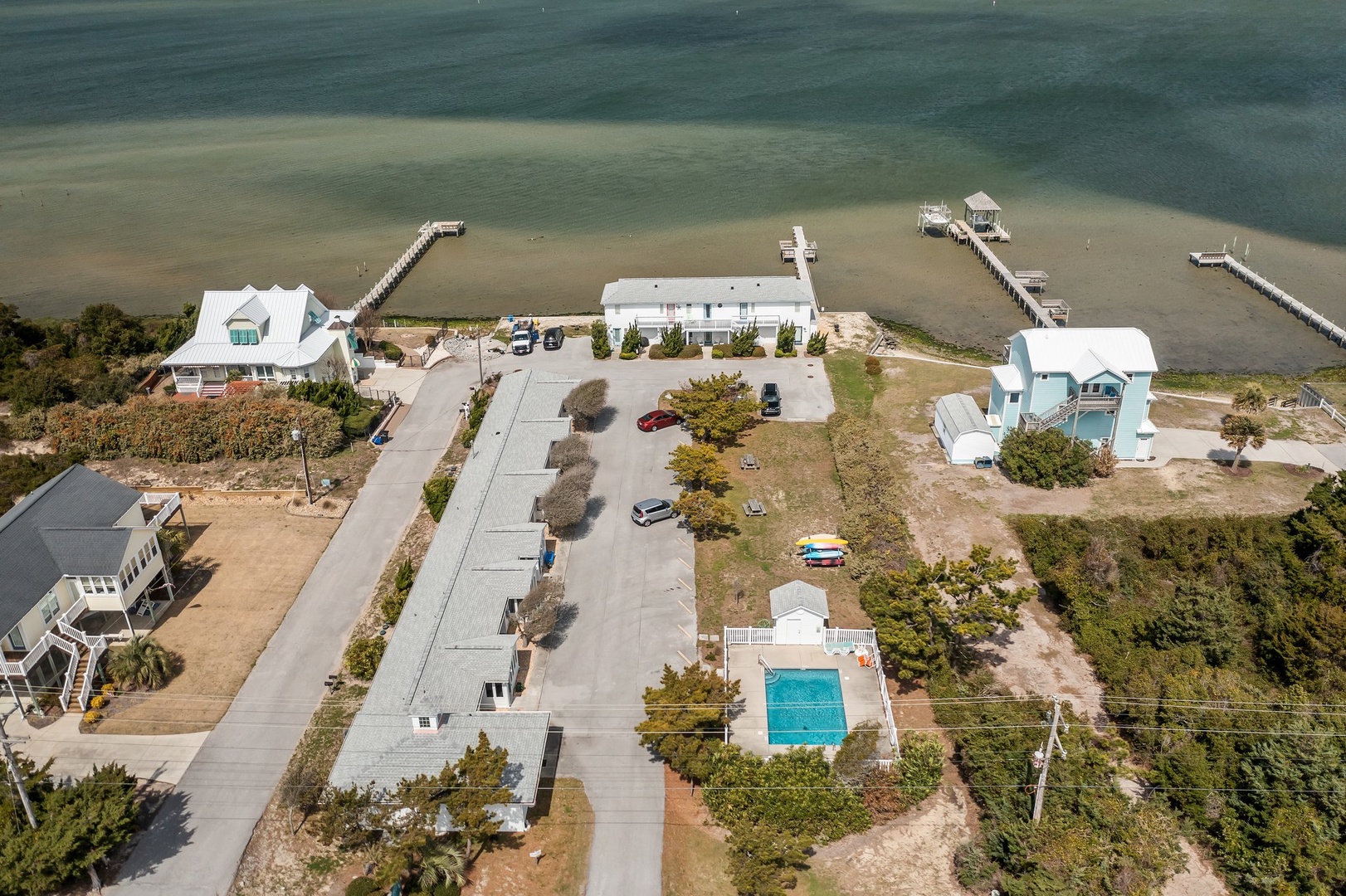 Waterfront vacation homes with private docks and swimming pool create the perfect coastal retreat.