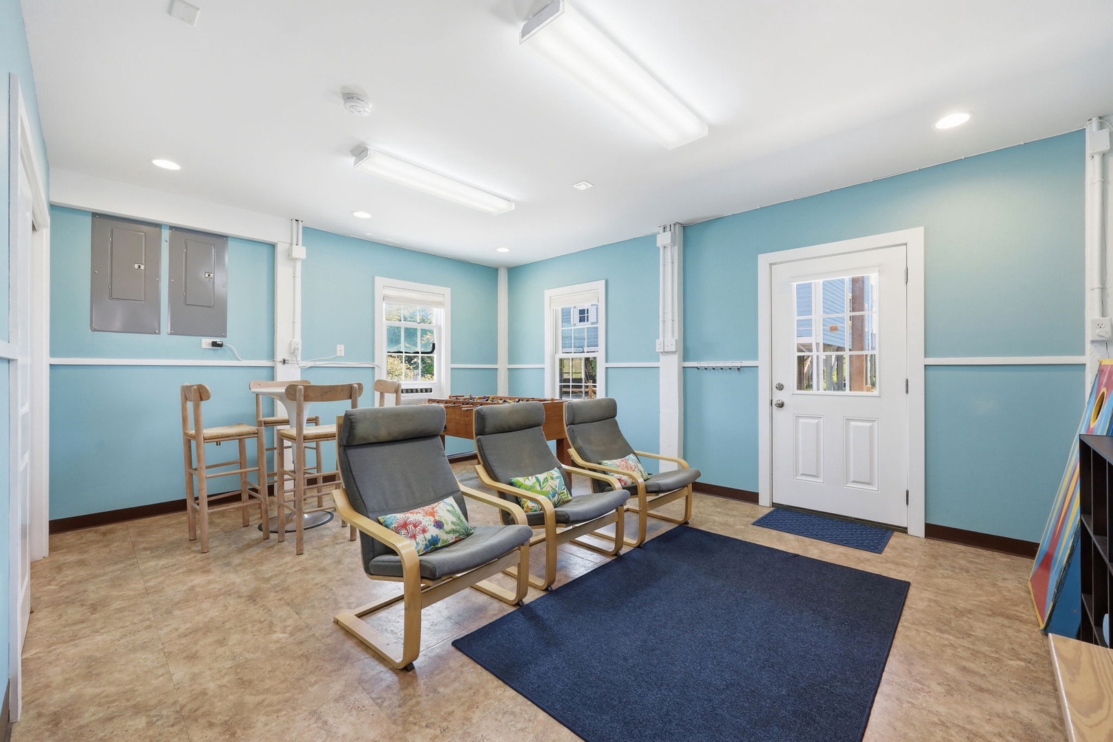 Unwind in this calming shared lounge, where soft blue walls and comfy seating invite you to relax with coffee, connect with fellow travelers, and plan your next adventure together.