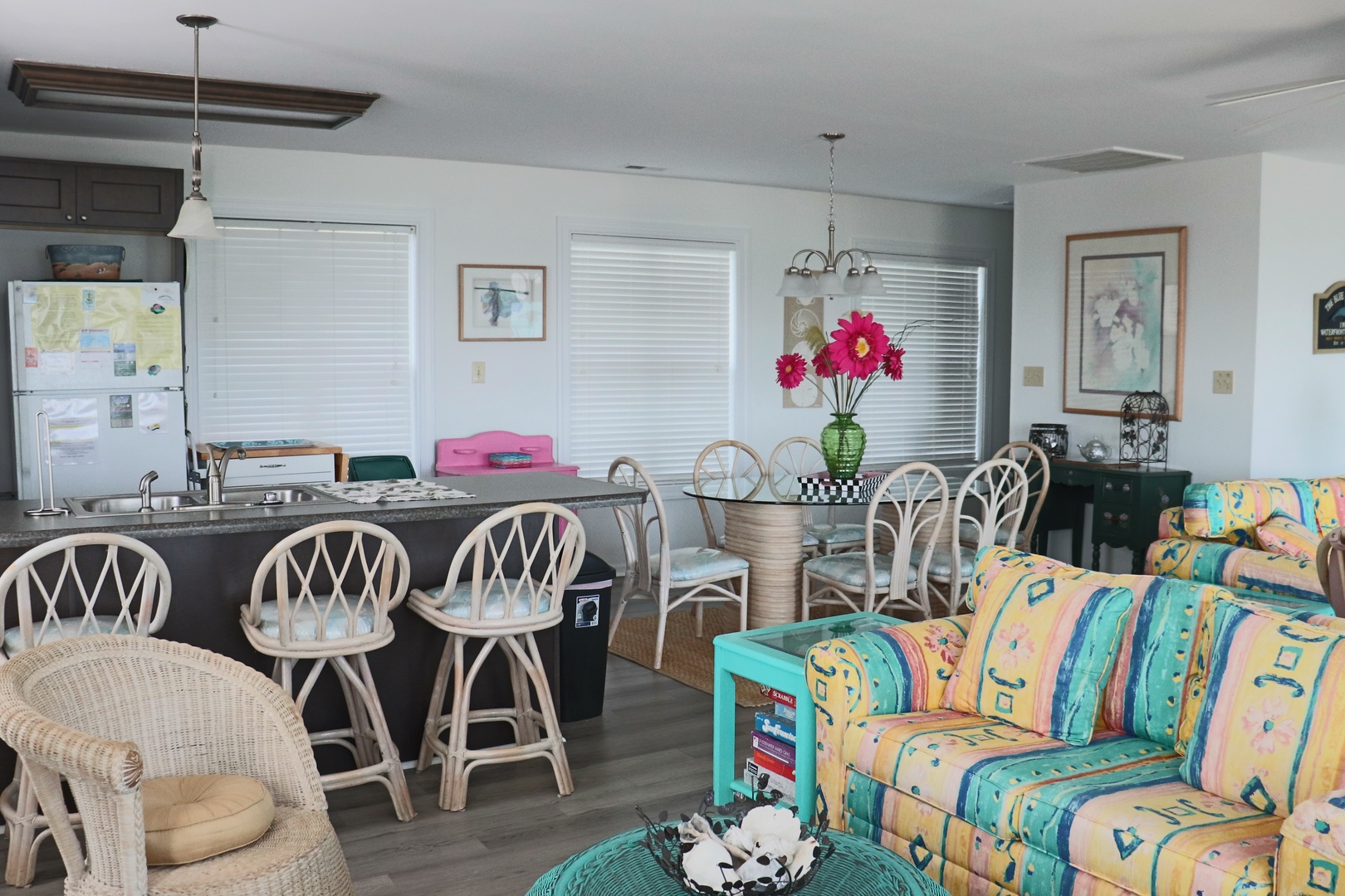 Your bright open-concept living space flows seamlessly from the cozy sitting area to the granite kitchen island, perfect for gathering and making memories.