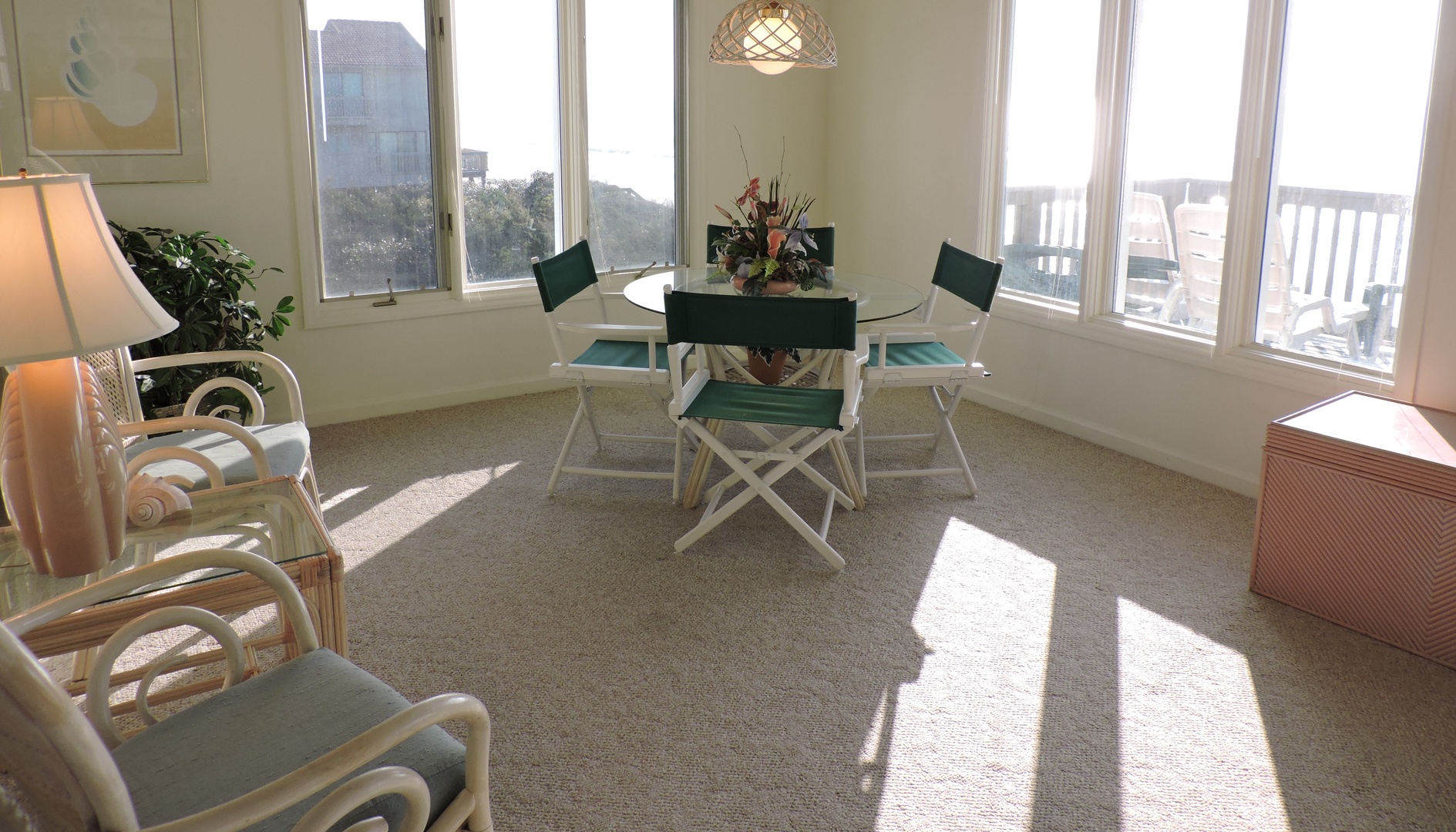 Gather around your bright dining space where natural light streams through panoramic windows, creating the perfect setting for memorable meals together.