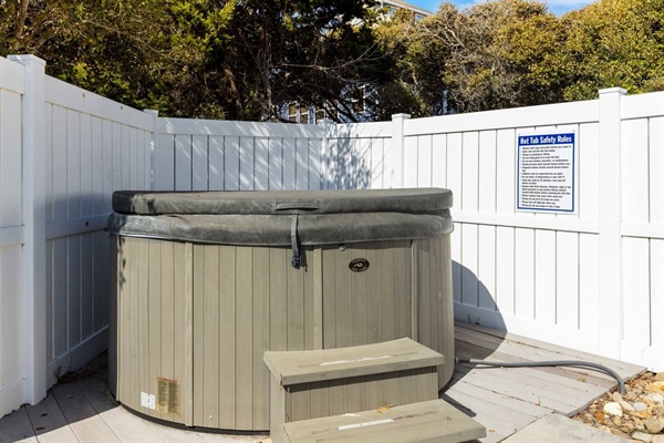 Soak away your worries in this private hot tub, nestled in a secluded corner where relaxation meets tranquility.