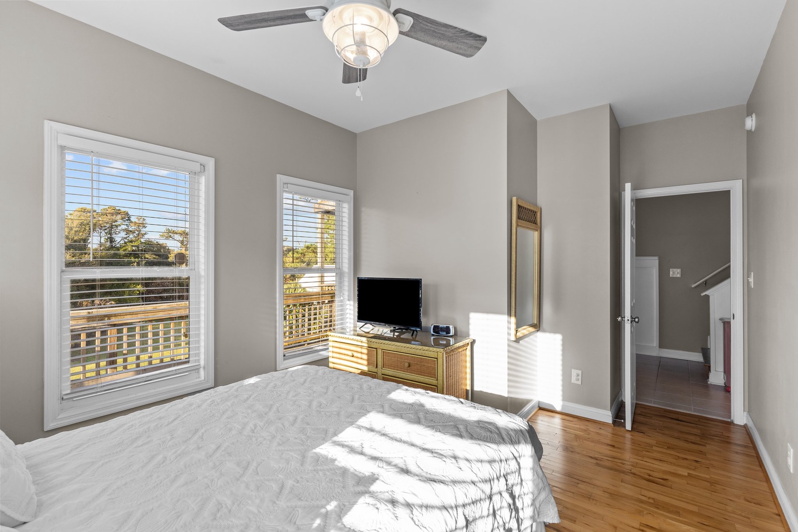 Unwind in your bright bedroom with natural light streaming through windows, creating a peaceful retreat for restful nights.