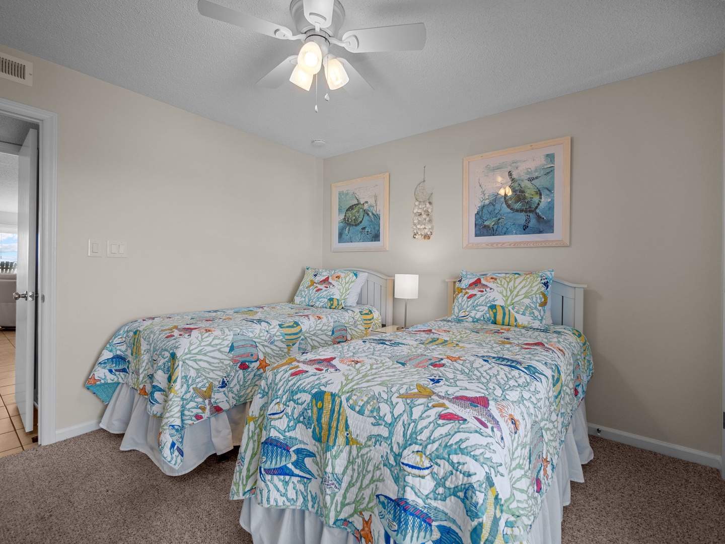 Drift off to sleep surrounded by cheerful ocean-themed artwork and vibrant marine life bedding that brings coastal charm to your twin bedroom.