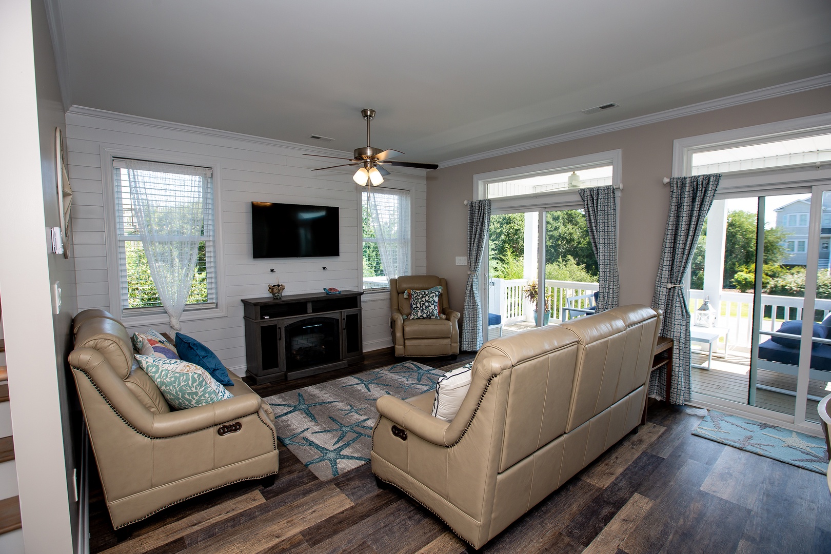 Settle into plush leather seating while enjoying your favorite shows on the wall-mounted TV, with sliding doors opening to your private deck.