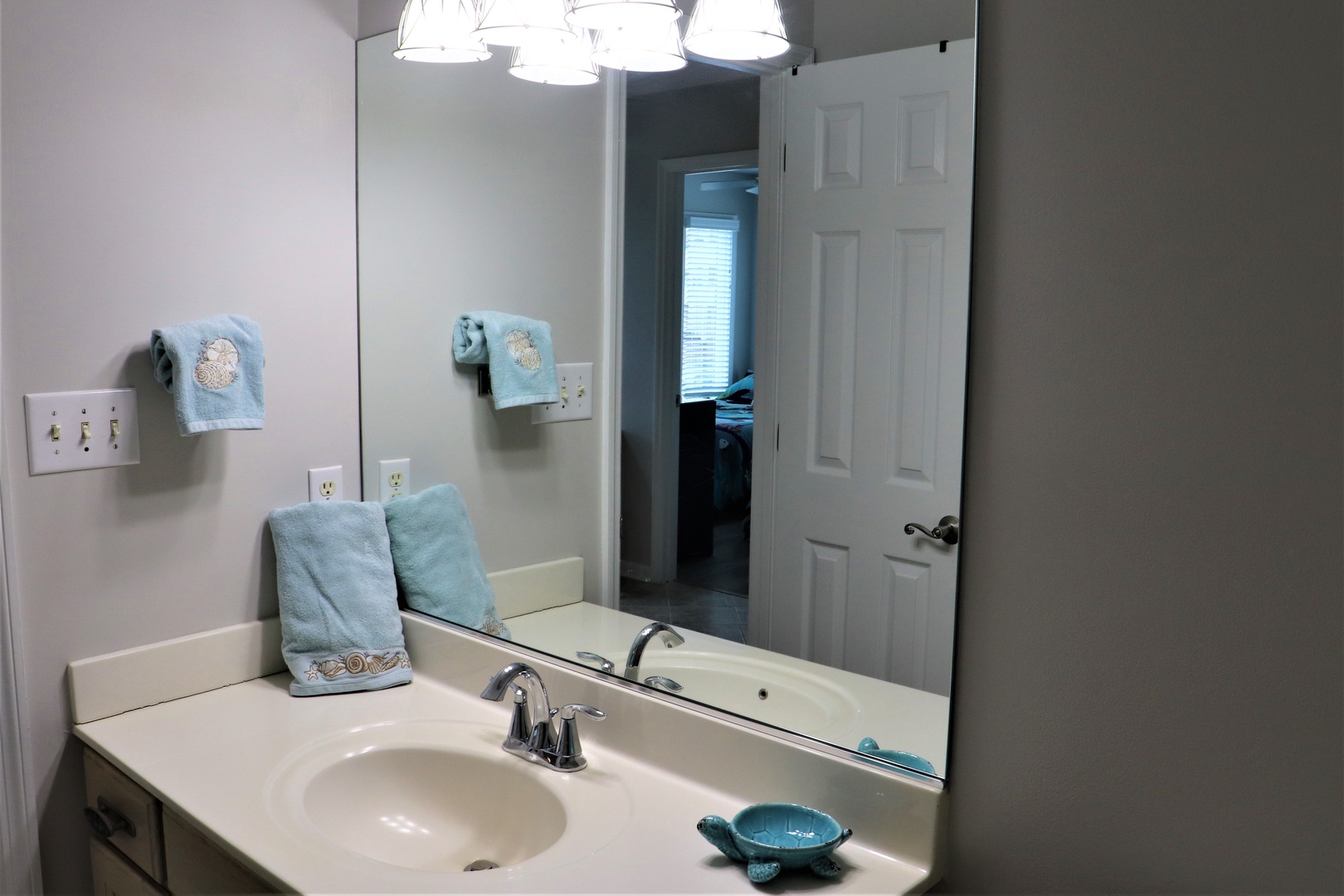 Fresh towels and thoughtful touches await in your private bathroom, complete with modern fixtures and peaceful lighting.