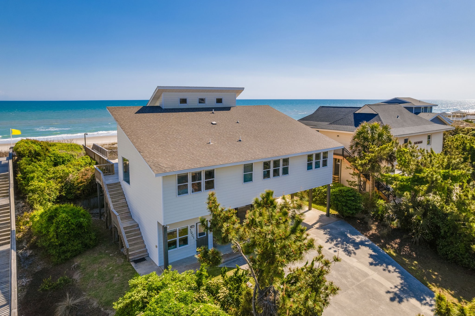 A prime beachfront location with pristine white sand beaches just steps away from this coastal property.